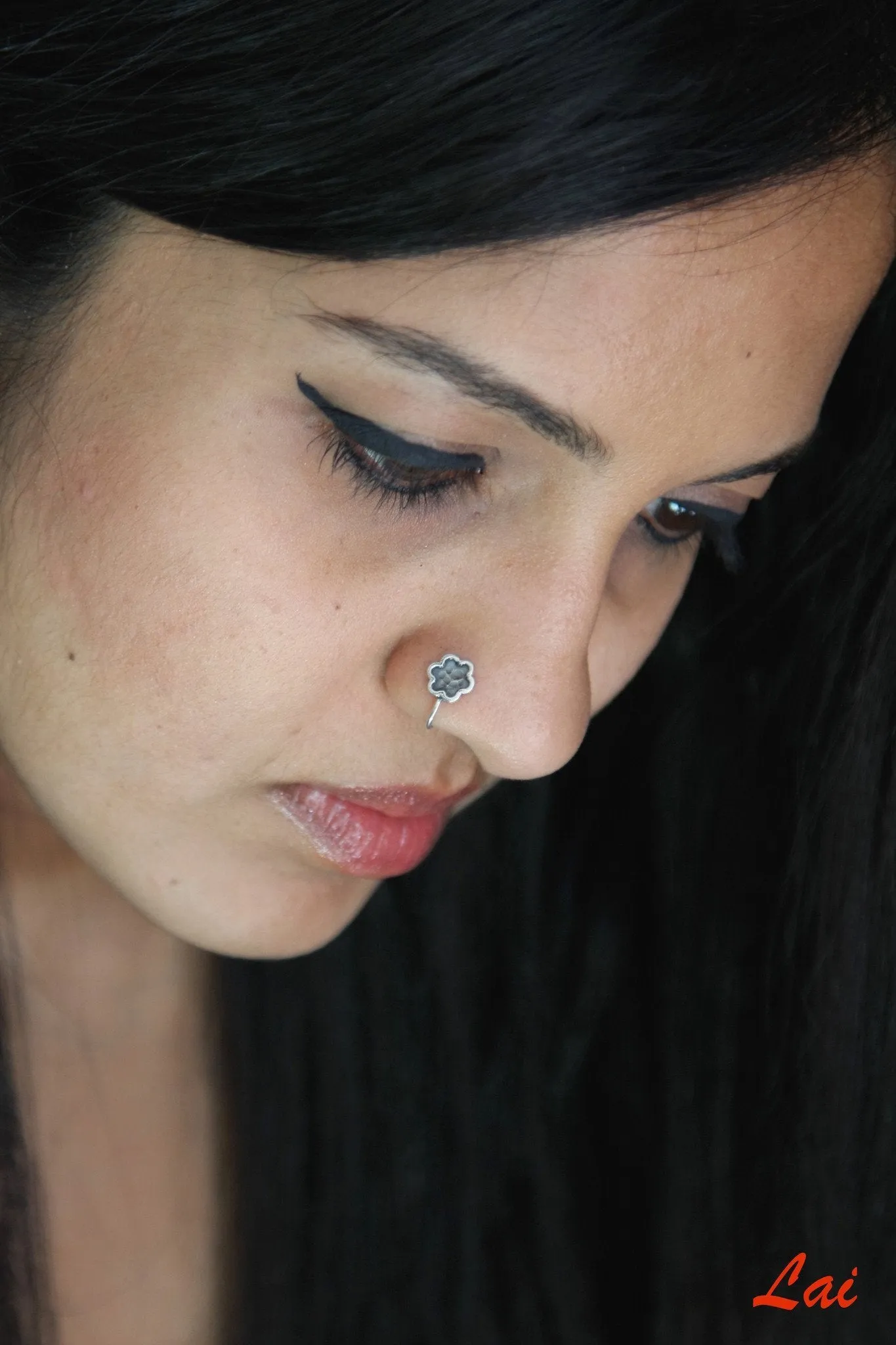 Oxidized, hammer-finish floral nose pin