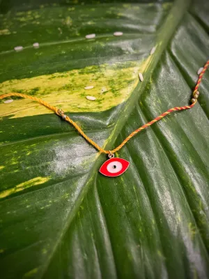 Unique Red Evil Eye Charm Designer Rakhi With Multicolored Thread For Raksha Bandhan Celebration